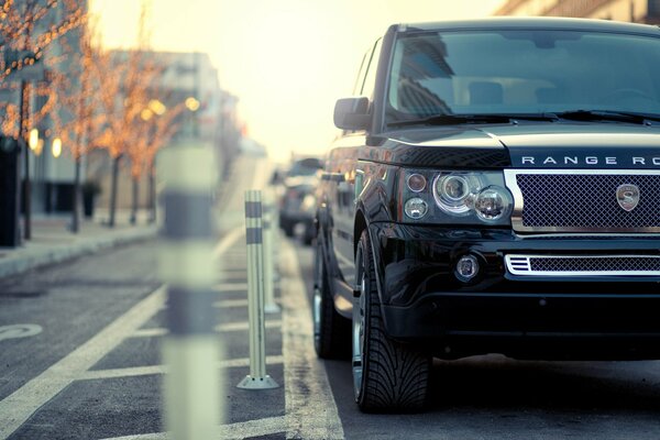 Black range rover in the parking lot