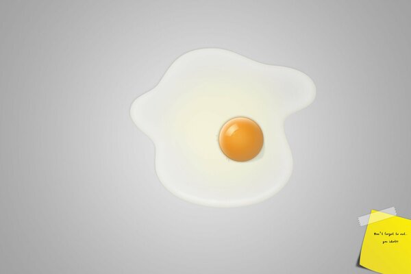 Scrambled eggs from one egg on a gray background with a yellow zarisk