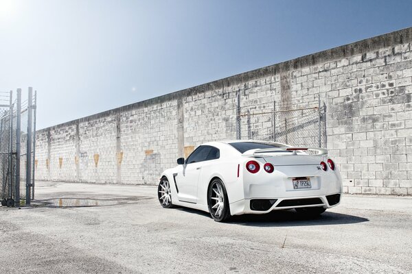 Nissan car on the background of the road