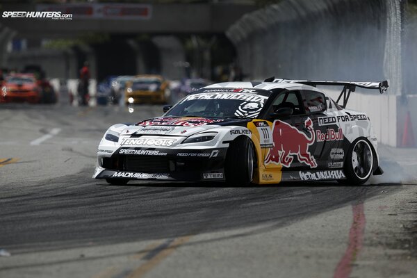 Mazda rx-8 with a red bull on the door