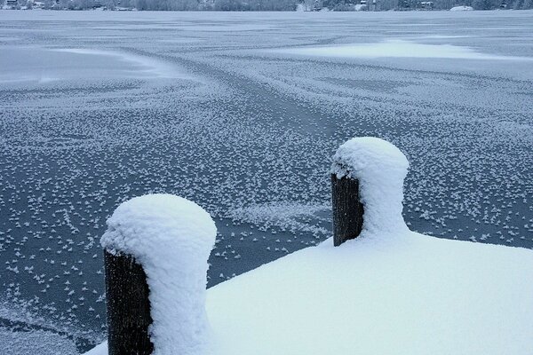 Winter pier completely covered with snow