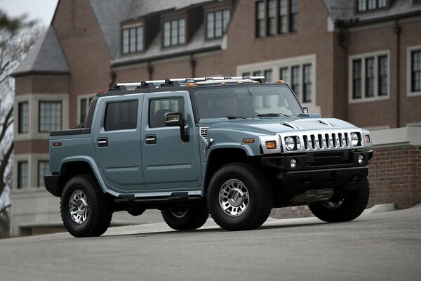 HUMMER PICKUP TRUCK ON A SMALL TOWN STREET