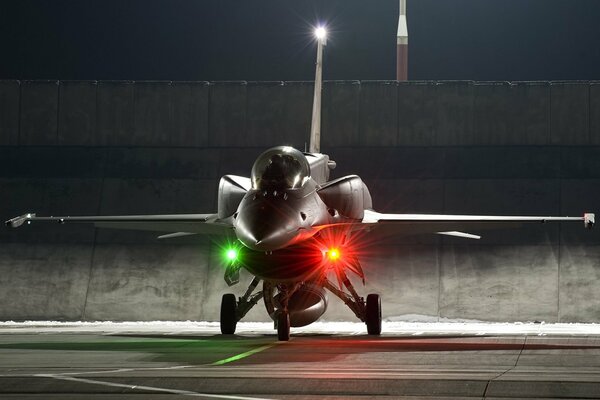 The F-16 fighter landed on the ground