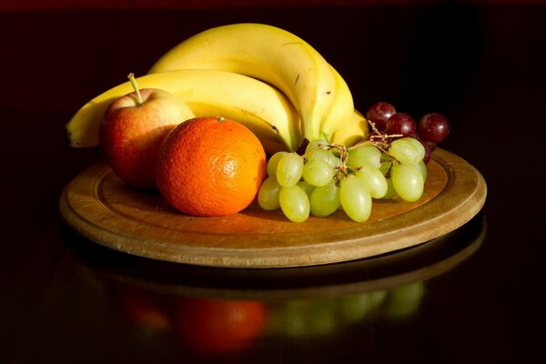 Fruit plate made of banana and grapes