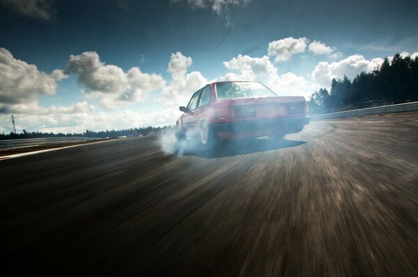 The car rushes along the highway against the background of NPBO and trees