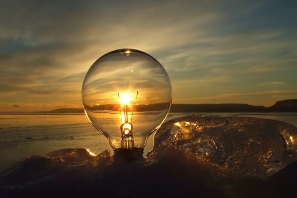 Reflection of the horizon through an incandescent lamp