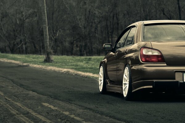 Beautiful tuned car on a country road