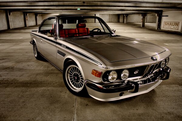 Bmw in the parking lot in the subway looks very daring