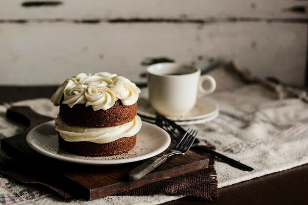 Cream cake on a wooden tray