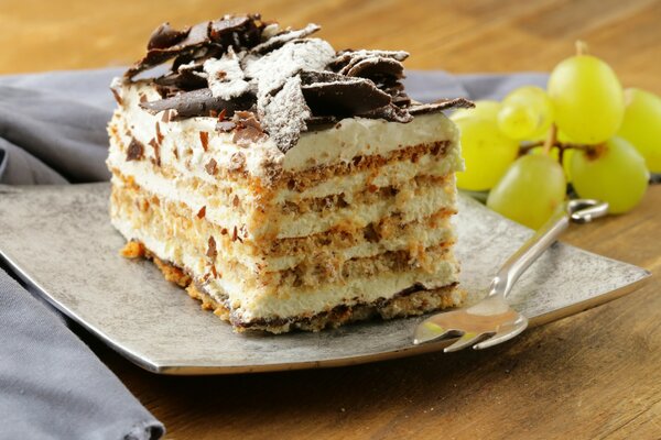 Sponge cake with a sprig of grapes