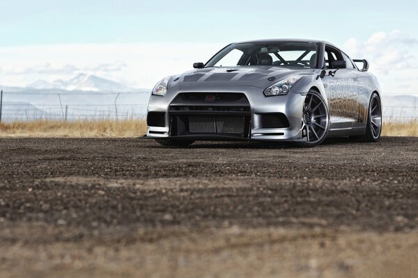 Nissan on a rocky road with mountain views