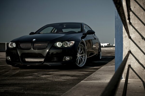 Black BMW with silver cool wheels