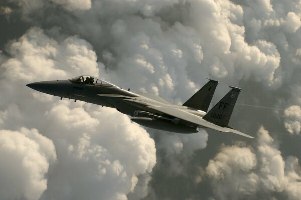 An American fighter jet against the clouds