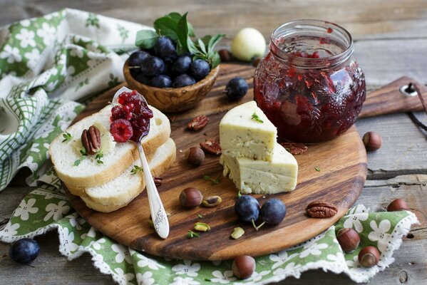 A bed of bread with jam and cheese