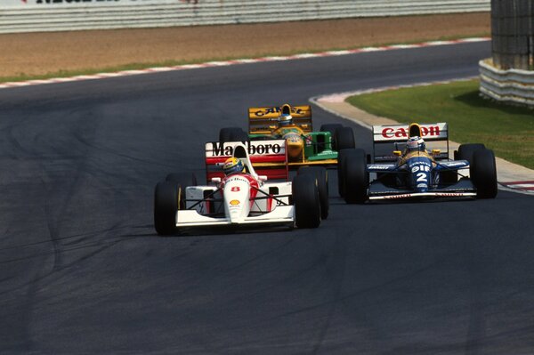 Three Formula 1 drivers compete in the race