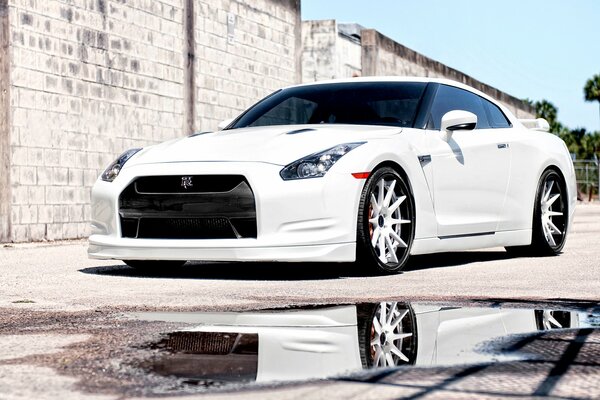 White Nissan parked on the street