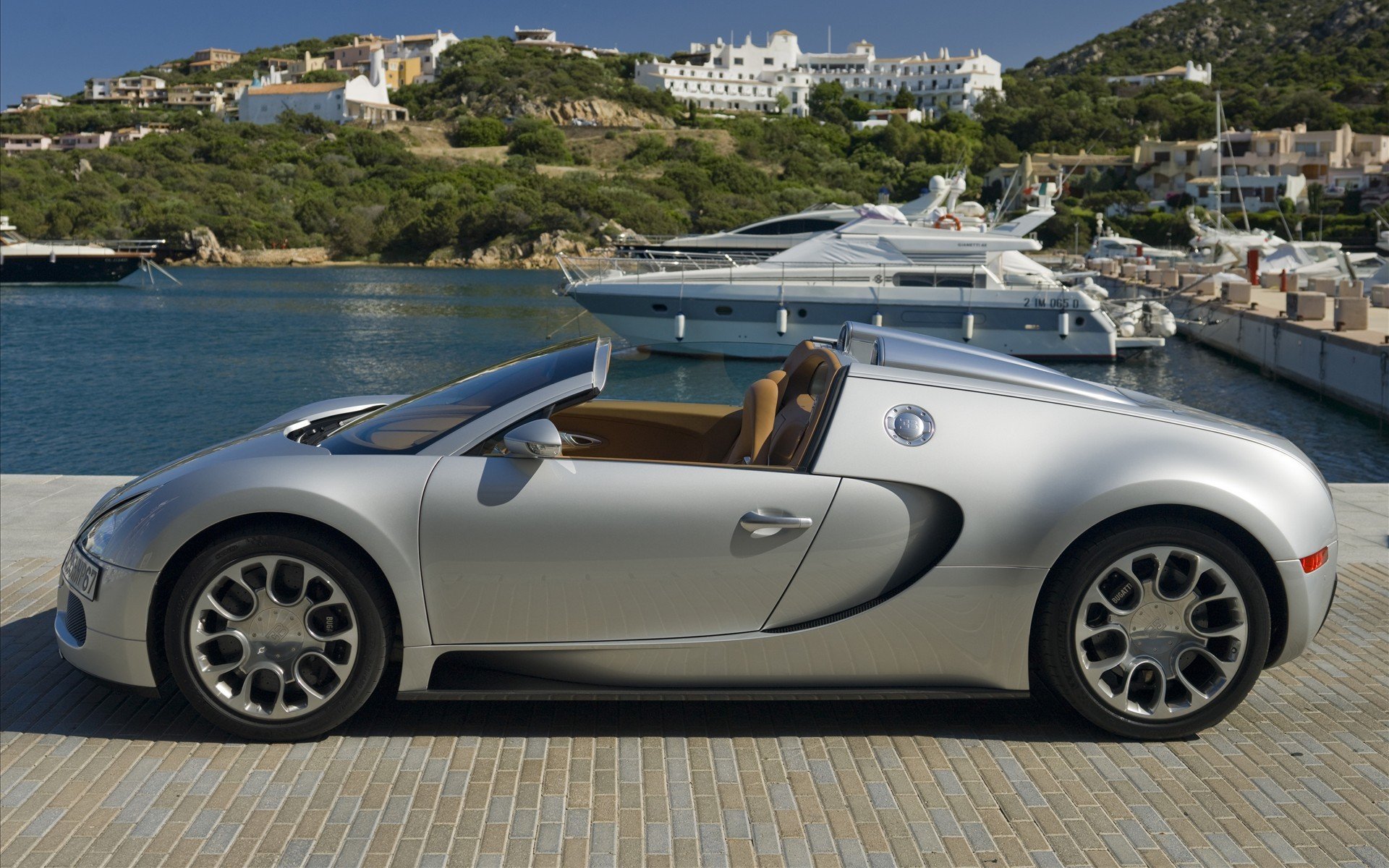 coche bugatti carretera muelle barco