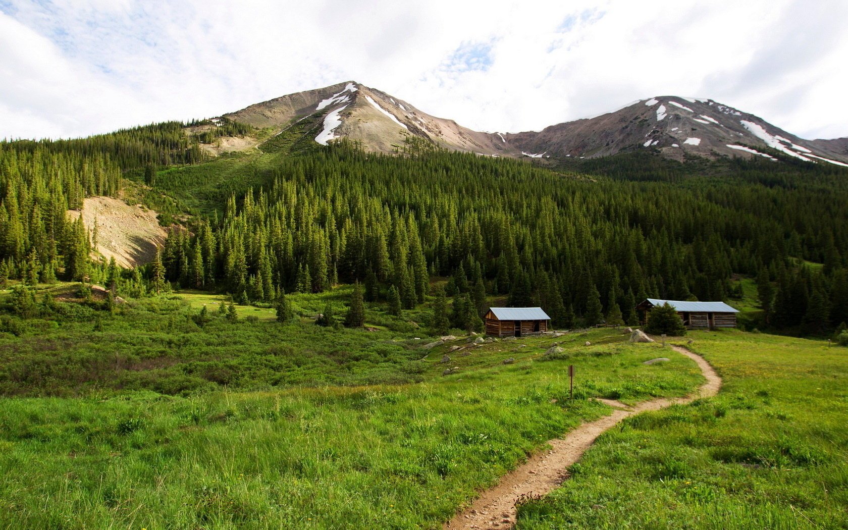 landscape mountains house road