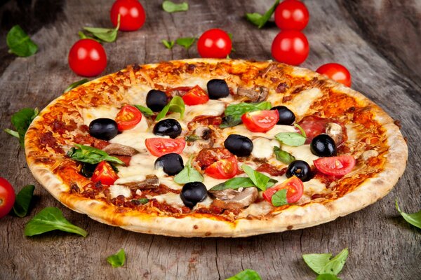 Pizza with olives and cherry tomatoes