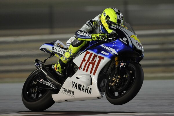 Racing motorcycle in motion on one wheel