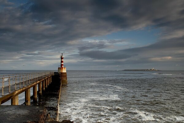 Stormy sea and lighthouse