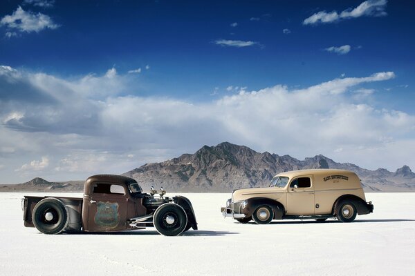 Two old men in the desert with clouds