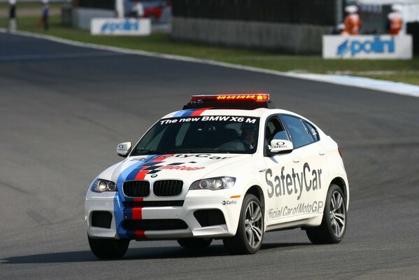 bmw x6 white safety car on the highway