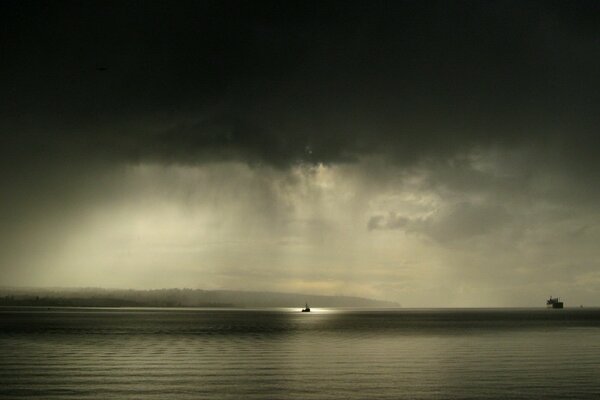 A ship at sea at night by moonlight