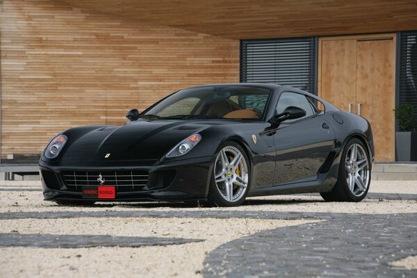 Black Ferrari in a wooden building