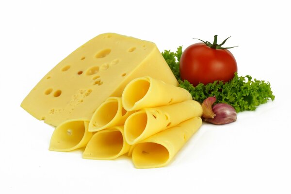 Cheese on a white background. Tomatoes and greens