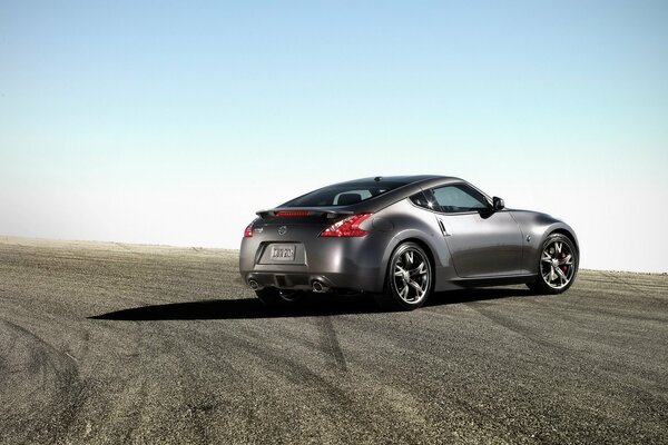 Nissan 370z stands on the road against the sky