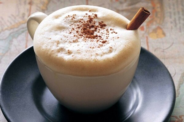 Freshly brewed coffee with foam and cinnamon