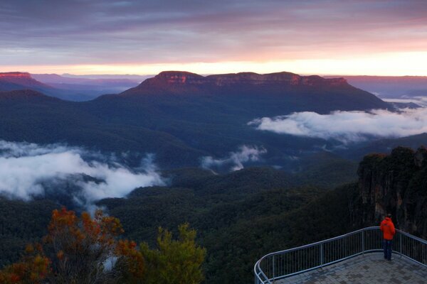 High in the mountains you can see clouds and see the tops of trees