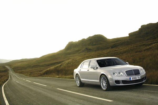 Bentley is driving at high speed on the road