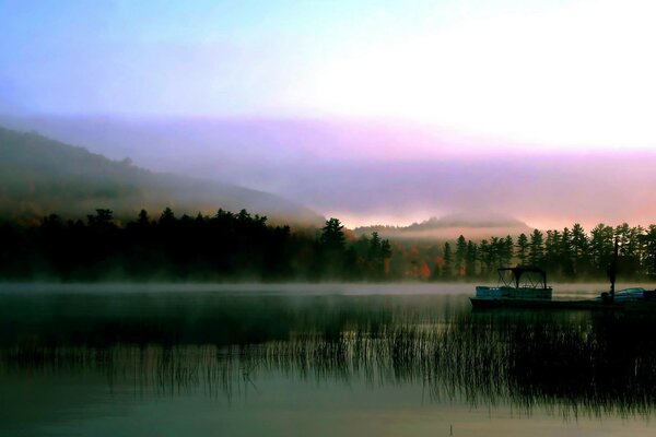 Fog. Sunrise. River. A boat