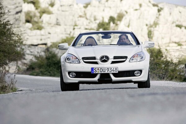 Mercedes car on the highway nafone mountains