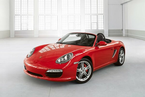 Red Porsche in a modern interior grey turbo Porsche