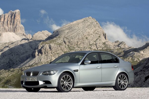 Silver-gray BMW on a mountain landscape