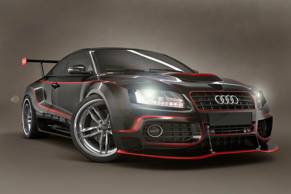 Black Audi with red inserts and headlights on