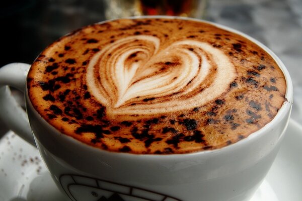 Coffee with foam and a heart pattern