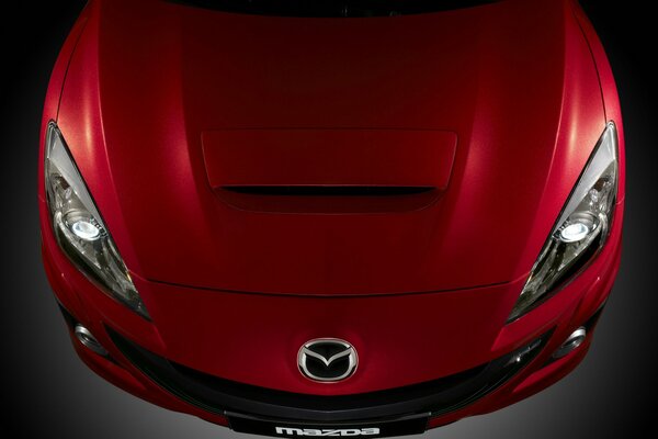 Bumper of a bright red new Mazda