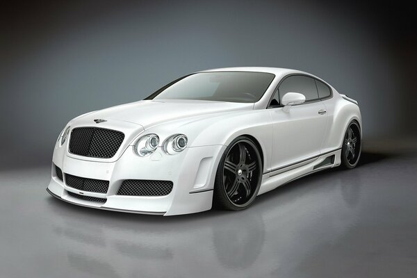 Beautiful white car on a gray background