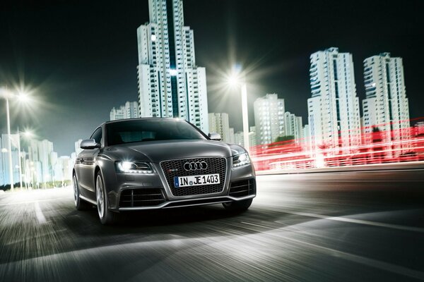 Gray Audi is heading to meet the night city