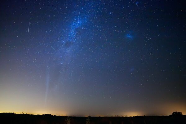 Comet on the background of magellanic clouds