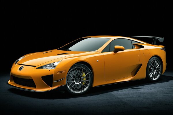 Beautiful yellow Lexus on a dark background 