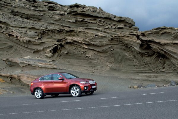 The car is on a mountain road. Only forward