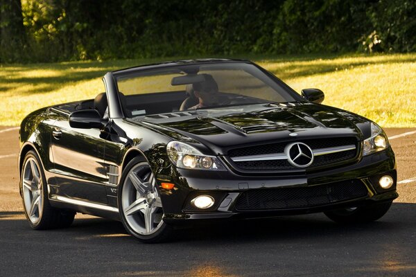 A black convertible in the sunset