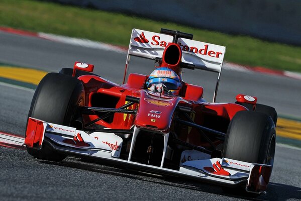 Ferrari on the Formula 1 track, enters the turn