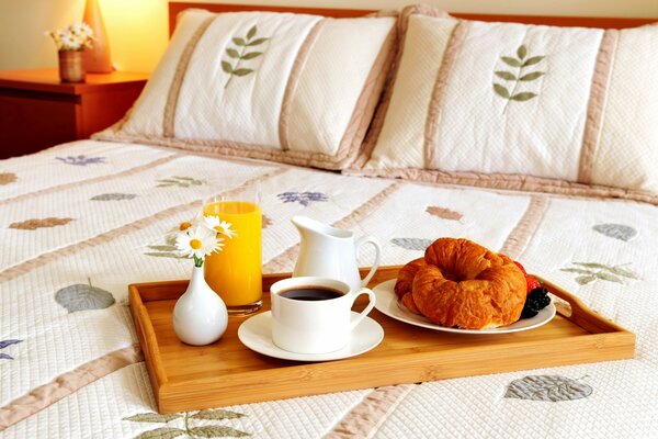 Breakfast in bed on a wooden tray