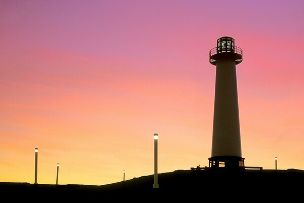 Pink sunset and lighthouse